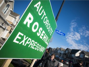 Area residents came together Sunday to unveil the 'Rosehill Expressway' sign, a comedic way to voice their concerns over the Johnwoods Street conversion.
