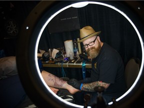 Jason Clay Dunn, known for winning the fifth season of  Spike TV's Ink Master was working on a tattoo at the Ottawa Gatineau Tattoo Expo 2017 at Hilton Lac-Leamy Sunday, November 12, 2017. Dunn, a tattoo artist from California was working on a zombie geisha for his client.   Ashley Fraser/Postmedia