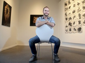 Jonathan Hobin sits in the new home of the School of the Photographic Arts: Ottawa.