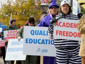 Some dressed up for Halloween while others simply carried placards, but more than a hundred Algonquin teachers protested outside of Bob Chiarelli's office on Carling Avenue Tuesday.