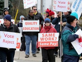 Striking Algonquin College faculty man picket lines on Monday, Nov. 13, 2017.