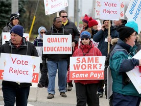 Strikers march at the entrance to Algonquin College on Nov. 13. (Photo: Julie Oliver, Postmedia)