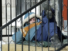 A homeless man bundles up in downtown Ottawa in this file photo.