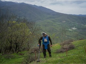 Arsen Anastasyan, a sapper with the charity HALO Trust, works to clear a minefield on April 20, 2015 in Hagob Kamari, Nagorno-Karabakh. Since signing a ceasefire in a war with Azerbaijan in 1994, Nagorno-Karabakh, officially part of Azerbaijan, has functioned as a self-declared independent republic and de facto part of Armenia. Twenty years ago, Canada was an active partner is ending the scourge of landmines, writes Hélène Laverdière. (Photo by Brendan Hoffman/Getty Images)