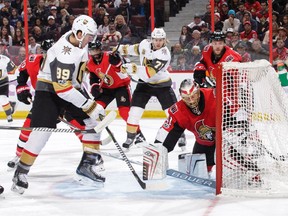 Golden Knights winger Alex Tuch shoves the puck past Senators netminder Craig Anderson to score the opening goal of Saturday's game.