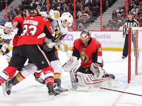 Craig Anderson of the Ottawa Senators makes a save against Tomas Nosek of the Vegas Golden Knights as Fredrik Claesson defends at the CTC on Saturday, Nov. 4, 2017.