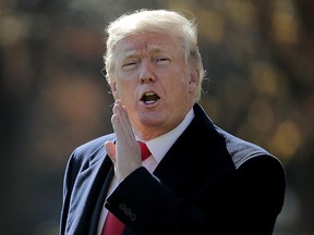 U.S. President Donald Trump shouts at journalists from across the South Lawn as he departs the White House on Wednesday.