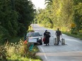This file photo taken on August 20, 2017 shows a cab dropping off a couple of asylum seekers at the US/Canada border near Champlain, New York.