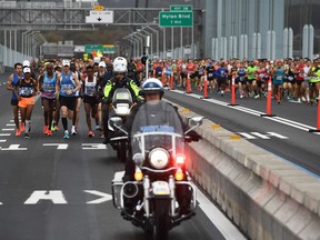 Runners compete during the 2017 TCS New York City Marathon in New York on November 5, 2017.  Five days after the worst attack on New York since September 11, 2001, the city is staging a show of defiance on November 5, as 50,000 runners from around the world are set to participate in the New York Marathon, under heavy security.