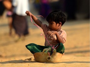 A Rohingya refugee child plays at the Kutupalong refugee camp in Bangladesh.