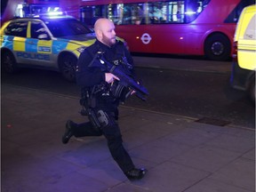 An armed policeman runs down Oxford Street in central London on November 24, 2017, as police responded to an incident.     British police said they were responding to an "incident" at Oxford Circus in central London on Friday and have evacuated the Underground station, in an area thronged with people on a busy shopping day.