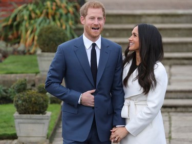 BRITAIN-ROYALS-MARRIAGE

Britain's Prince Harry stands with his fiancée US actress Meghan Markle as she shows off her engagement ring whilst they pose for a photograph in the Sunken Garden at Kensington Palace in west London on November 27, 2017, following the announcement of their engagement. Britain's Prince Harry will marry his US actress girlfriend Meghan Markle early next year after the couple became engaged earlier this month, Clarence House announced on Monday. / AFP PHOTO / Daniel LEAL-OLIVASDANIEL LEAL-OLIVAS/AFP/Getty Images
DANIEL LEAL-OLIVAS, AFP/Getty Images