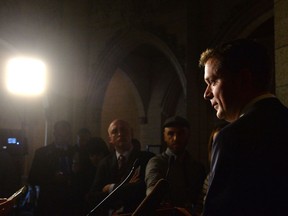 Conservative leader Andrew Scheer speaks with the media in the Foyer of the House of Commons Wednesday, Nov. 29, 217. Scheer is calling for embattled Finance Minister Bill Morneau to resign. THE CANADIAN PRESS/Adrian Wyld