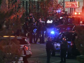 Emergency crews and police work at the scene in response to a shooting at Walmart in Thornton, Colo., Wednesday, Nov. 1, 2017. Police in suburban Denver say they are responding to a shooting at a Walmart with "multiple parties down." Dozens of police cars and emergency vehicles converged at the store.