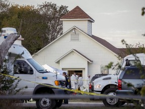 Investigators work at the scene of a deadly shooting at the First Baptist Church in Sutherland Springs, Texas, Sunday Nov. 5, 2017.