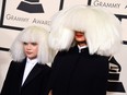 Sia, right, and Maddie Ziegler arrive at the 57th annual Grammy Awards at the Staples Center on Sunday, Feb. 8, 2015, in Los Angeles.