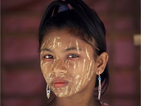 A Rohingya girl with her face covered in "thanaka", a comestic paste from ground bark, stands in her family's tent on Tuesday, Nov. 21, 2017, in Kutupalong refugee camp in Bangladesh. Since late August, more than 620,000 Rohingya have fled Myanmar's Rakhine state into neighboring Bangladesh, seeking safety from what the military described as "clearance operations." The United Nations and others have said the military's actions appeared to be a campaign of "ethnic cleansing," using acts of violence and intimidation and burning down homes to force the Rohingya to leave their communities. (AP Photo/Wong Maye-E) ORG XMIT: XWM112
Wong Maye-E, AP