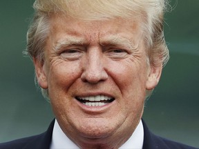 U.S. President Donald Trump attends the family photo session at the APEC Summit on Saturday. Jorge Silva/Pool Photo