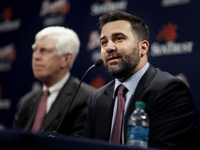 Alex Anthopoulos, right, speaks at a news conference introducing him as the new general manager of the Atlanta Braves on Monday, Nov. 13, 2017. Terry McGuirk, left, is the chairman and CEO of the team.