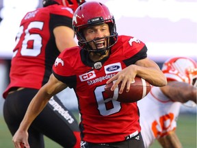 Stamps punter Rob Maver runs the ball for a first down against the Lions during a game on Sept. 16.  Gavin Young/Postmedia