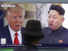 In this Aug. 10, 2017, file photo, a man watches a TV screen showing U.S. President Donald Trump and North Korean leader Kim Jong Un, right, during a news program at the Seoul Train Station in Seoul, South Korea. Did Trump's recent trip to Asia help with the North Korea situation? asks James Trottier.
