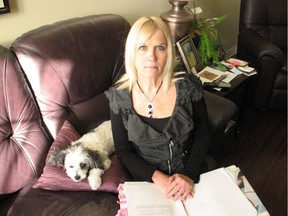 Cornwall mom Julie Papineau, looking over one of the binders of paper work she's buried herself in over the last year-and-a-half, since her teenage daughter Madeline got seriously ill after consuming a green tea extract product.