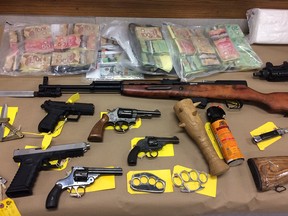 Money and weapons seized by the OPP during Project Landslide.