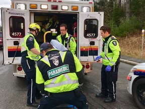 Paramedics and firefighters worked to free a man trapped in his car after a crash on Innes Road Wednesday morning.