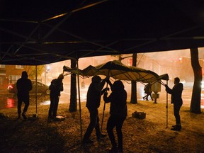 file photo/ Volunteers and organizers of OPO (Overdose Prevention Ottawa) packs it in on the last night of the popup injection site at Raphael Brunet park on Thursday, Nov. 9, 2017.