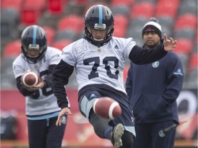 Argonauts punter/kicker Lirim Hajrullahu practises with his teammates in Ottawa earlier in Grey Cup week. THE CANADIAN PRESS/Adrian Wyld