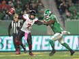 Roughriders defensive lineman A.C. Leonard puts pressure on Redblacks quarterback Trevor Harris in the first half of a game at Regina on Oct. 13. THE CANADIAN PRESS/Mark Taylor