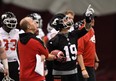 Calgary Stampeders head coach Dave Dickenson and Bo Levi Mitchell take part in the Grey Cup West Division champions practice in Ottawa on Wednesday, (THE CANADIAN PRESS/Sean Kilpatrick)