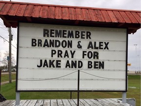 A sign for Brandon Hanniman and Alex Paquette, both 18, who died in a single-vehicle crash on Calabogie Road.