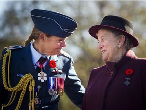 Gov. Gen. Julie Payette, commander-in-chief, wearing the uniform of the RCAF, chats with national Silver Cross Mother Diane Abel, whose son, Cpl. Michael David Abel, was killed while serving in Somalia in 1993.