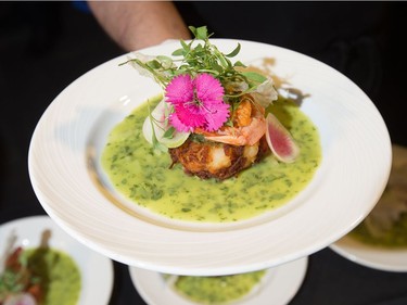 Chef Marc Doiron of town prepared a plate of green chili pozole verde and hominy cake, as the annual Gold Medal Plates, which challenged ten different area chefs to prepare a winning recipe, took place at the Shaw Centre.  Photo Wayne Cuddington/ Postmedia
Wayne Cuddington, Postmedia