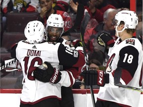 Arizona Coyotes' Anthony Duclair (10) celebrates his goal with teammates Max Domi (16) and Christian Dvorak (18) during first period action in Ottawa on Saturday.