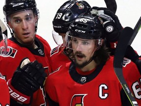A subdued Ottawa Senators captain, Erik Karlsson, is congratulated after scoring late against the Vegas Golden Knights.