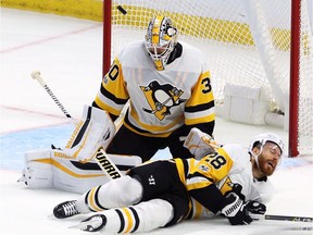 Pittsburgh Penguins defenceman Ian Cole (28) blocks a shot in front of goalie Matt Murray (30) during the second period against the Ottawa Senators at the CTC on Thursday, Nov. 16, 2017.