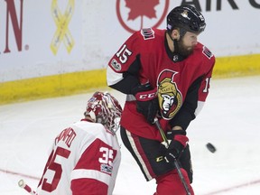 The Senators' Zack Smith screens Detroit Red Wings goalie Jimmy Howard on a shot during the first period on Thursday, Nov. 2, 2017 in Ottawa.