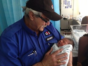 Samy Khoury, who died in September, two months after being assaulted in a downtown Ottawa parking garage. The infant in the picture is his grandson, Ethan. Source: Courtesy of the Khoury family