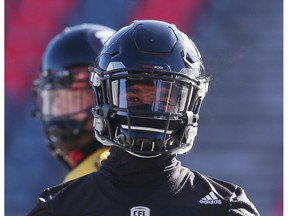 Redblacks defensive halfback Sherrod Baltimore bundles up against the chill for practice on Friday. Jean Levac/Postmedia