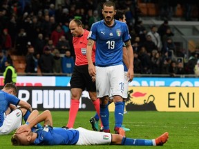 Andrea Belotti, Ciro Immobile and Leonardo Bonucci of Italy dejected at the end of its match against Sweden