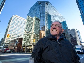 David McGee, standing at the corner of Slater and Metcalfe Streets, is the author of Lost Ottawa, a collection of pictures and stories from the Facebook page dedicated to all the buildings, places and events that have begun to disappear but have shaped Ottawa over the years.