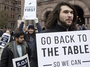 Students demonstrate outside the Ontario Legislature in Toronto on Wednesday November 1, 2017, as they protest against the ongoing strike by Ontario faculty members.