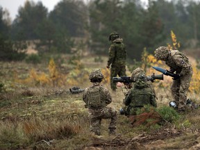 A member of the British unit Delta Company, 5th Battalion, The Rifles (5 Rifles) loads a Canadian Carl Gustaf M4 for a member of Princess Patriciaís Canadian Light Infantry, Bravo Company during a training activity at the training area of Camp Adazi in Latvia on October 17, 2017.