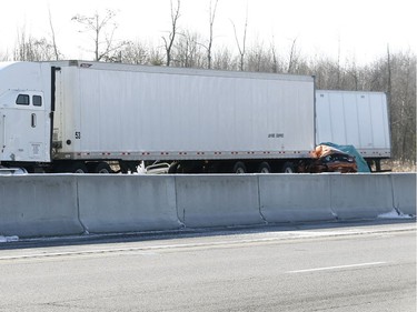 OPP investigate an accident on Highway 401 just east of Prescott Ontario Tuesday Nov 28, 2017. A Quebec trucker was arrested early Tuesday morning hours after two people were killed in a five-vehicle crash late Monday on Highway 401. Four people were also taken to hospital after the crash at about 10:30 p.m. Monday between Prescott and Highway 416, one of them by air ambulance with life-threatening injuries.