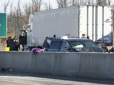 OPP investigate an accident on Highway 401 just east of Prescott Ontario Tuesday Nov 28, 2017. A Quebec trucker was arrested early Tuesday morning hours after two people were killed in a five-vehicle crash late Monday on Highway 401. Four people were also taken to hospital after the crash at about 10:30 p.m. Monday between Prescott and Highway 416, one of them by air ambulance with life-threatening injuries.