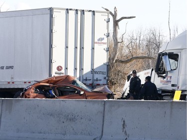 OPP investigate an accident on Highway 401 just east of Prescott Ontario Tuesday Nov 28, 2017. A Quebec trucker was arrested early Tuesday morning hours after two people were killed in a five-vehicle crash late Monday on Highway 401. Four people were also taken to hospital after the crash at about 10:30 p.m. Monday between Prescott and Highway 416, one of them by air ambulance with life-threatening injuries.