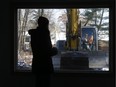 Karalee Shaw Plourde stands in her house one last time before it is demolished.