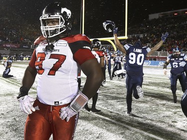 The Toronto Argonauts took on the Calgary Stampeders during the 105th Grey Cup at Lansdowne Park in Ottawa Sunday Nov 26, 2017. The Toronto Argonauts celebrates winning the Grey Cup against the Calgary Stampeders 27-24 Sunday night in Ottawa. Calgary's Derek Wiggan walks off the field dejected.